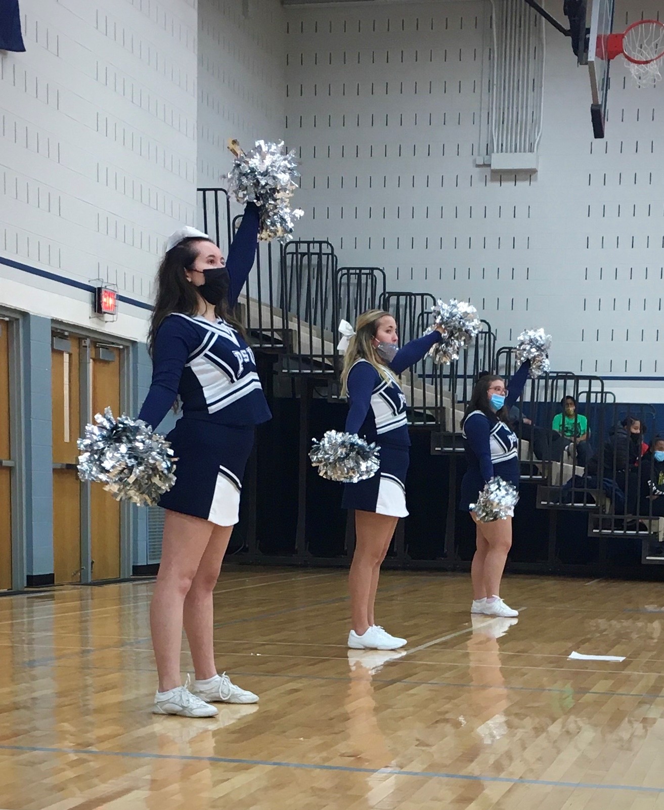 Lauren Bowen (center) was recently named Penn State Mont Alto's cheerleader of the month for December 2021.